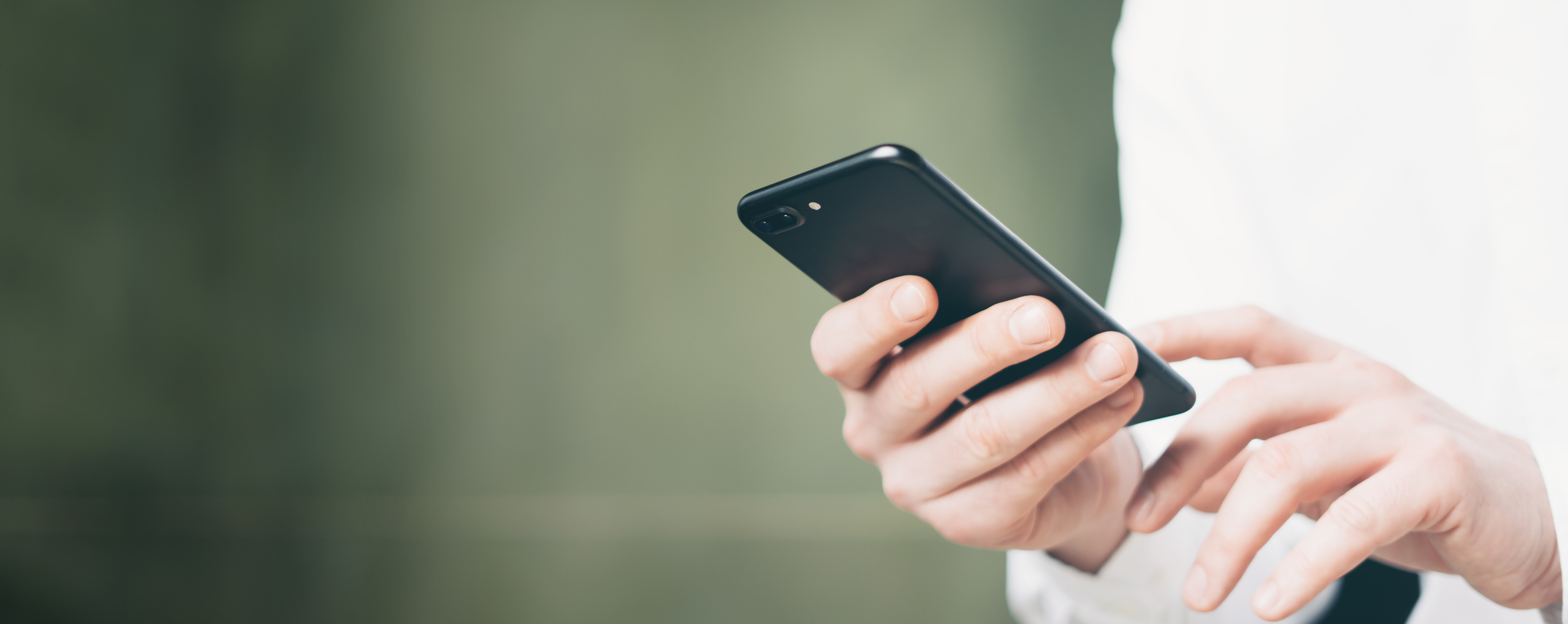 Male hands with mobile phone